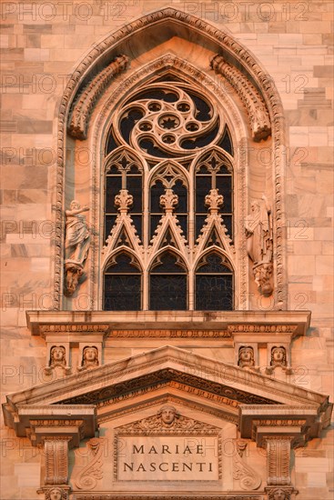 Window over the main portal of the west facade of Milan Cathedral or Duomo di Santa Maria Nascente