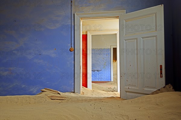 Room in a house that has been filled by desert sand