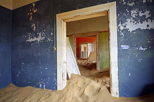 Room in a house that has been filled by desert sand