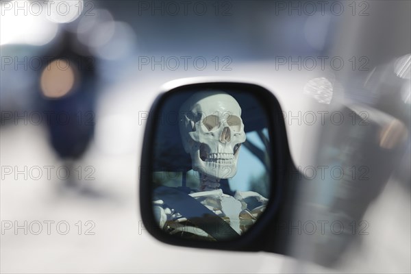 Skeleton at the wheel of a car