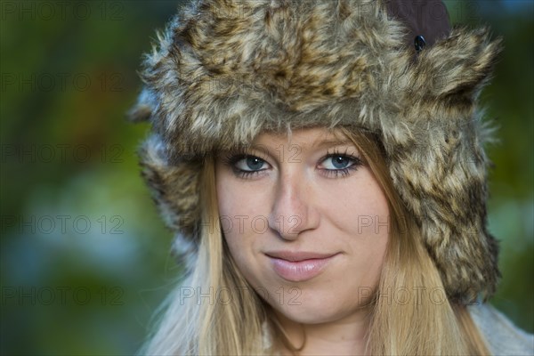 Young woman wearing a fur hat