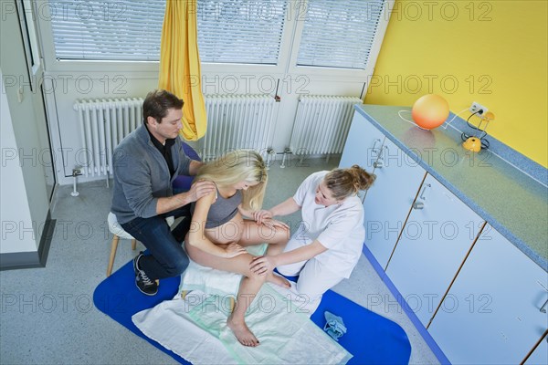 Man and woman in the delivery room during childbirth