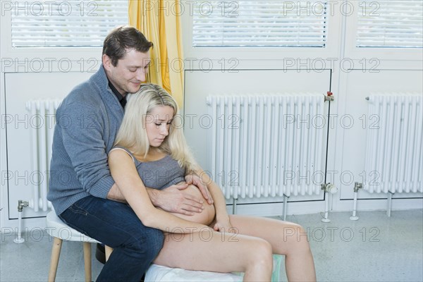 Man and woman in the delivery room during childbirth