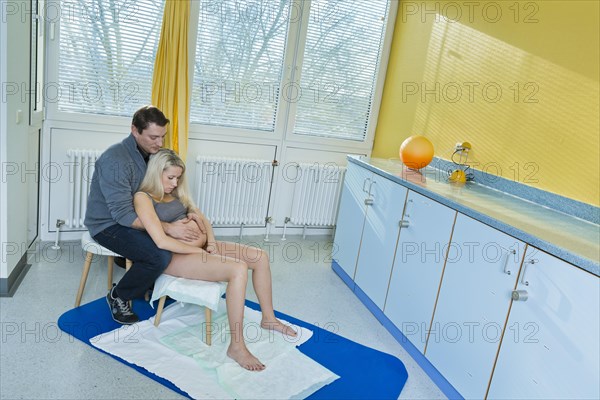 Man and woman in the delivery room during childbirth