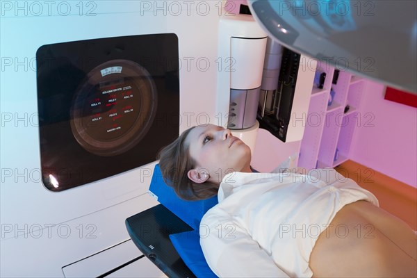 Patient lying in a linear particle accelerator for radiation treatment