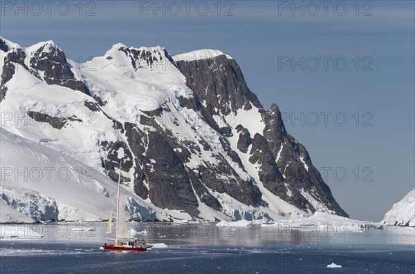 Small sailing boat in the Lemaire Channel