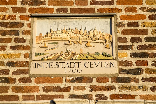 Plaque with a townscape from 1700 above an entrance