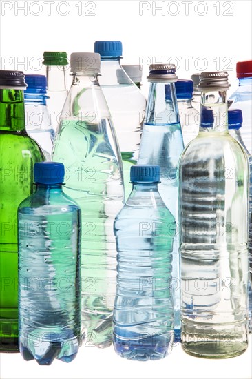 Different varieties of mineral water in bottles made of glass and plastic or PET