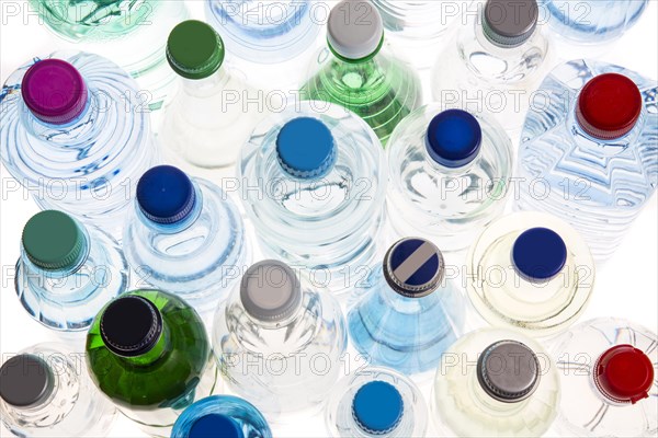 Different varieties of mineral water in bottles made of glass and plastic or PET