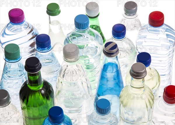 Different varieties of mineral water in bottles made of glass and plastic or PET