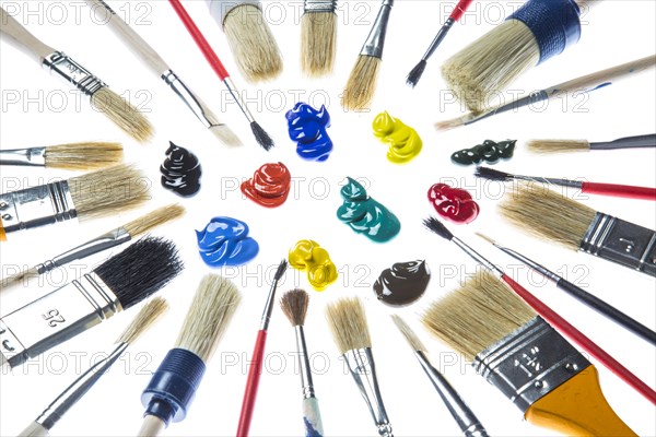 Different types of brushes and blobs of paint