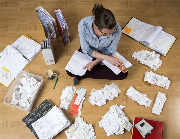 Woman sorting documents