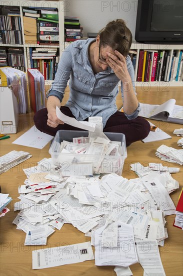 Woman sorting documents