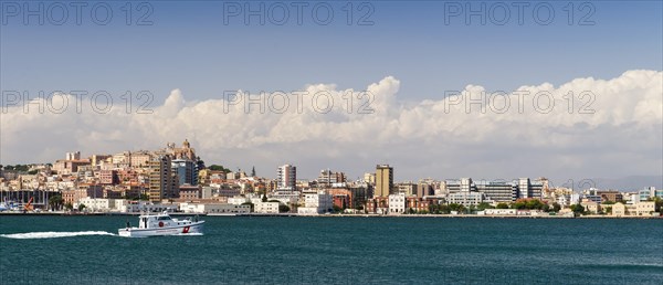 A police boat travelling in front of Cagliari