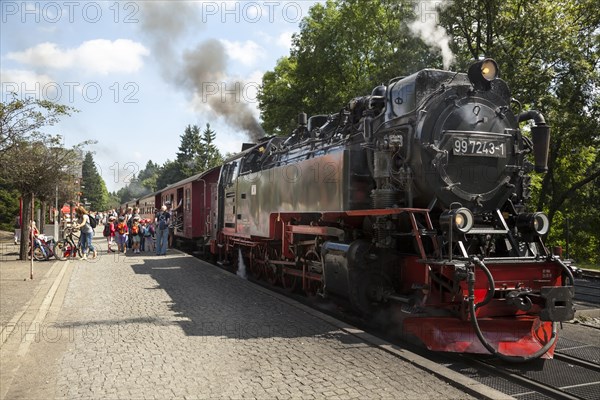 Brockenbahn steam train with tourists boarding
