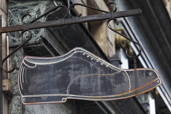 Shop sign of an old fashioned shoe shop