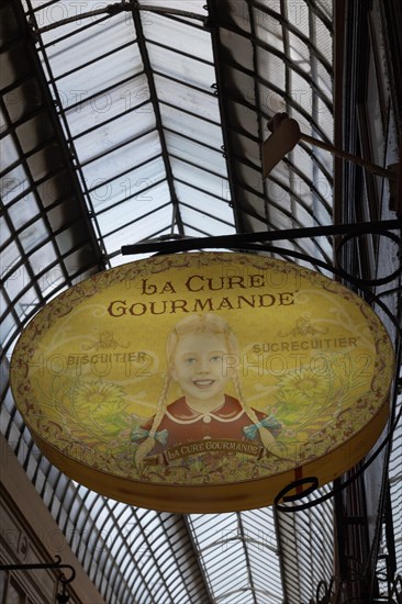 Shop sign with the image of a girl