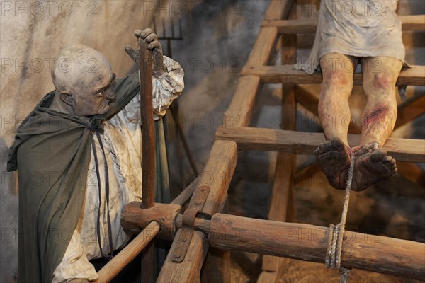 Man being tortured on a rack