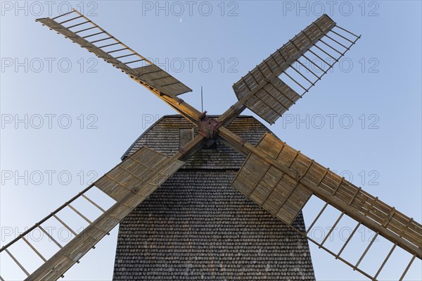 Historic post windmill with wooden shingle cladding