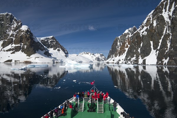 Visitors on the bow of the expedition cruise ship