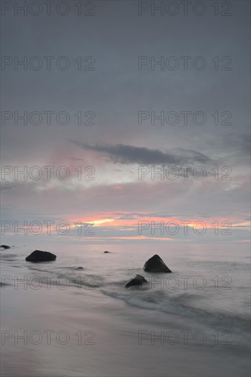 Stones on the beach at sunset