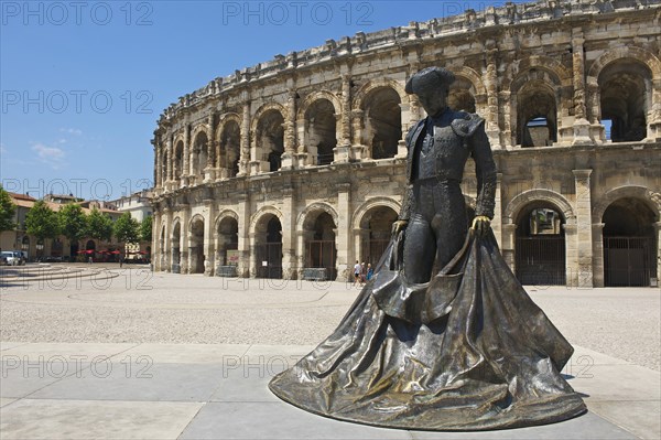 Statue of a bullfighter in front of the Roman amphitheatre