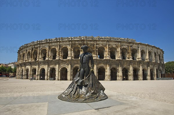 Statue of a bullfighter in front of the Roman amphitheatre