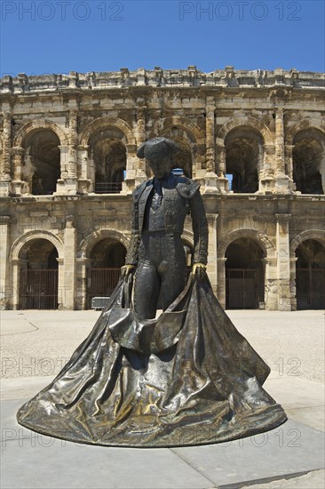 Statue of a bullfighter in front of the Roman amphitheatre