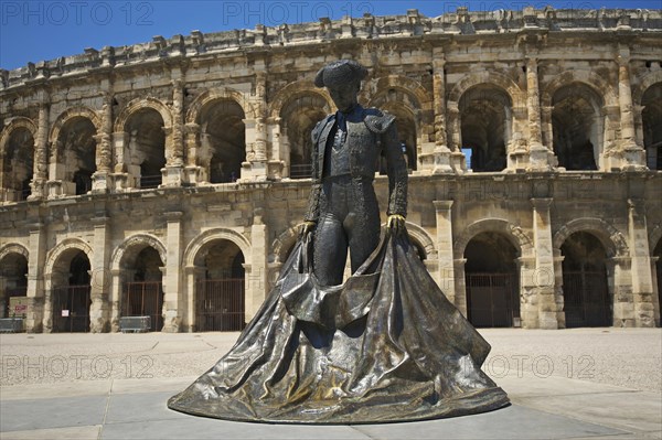 Statue of a bullfighter in front of the Roman amphitheatre