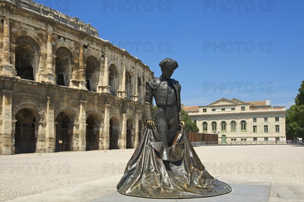 Statue of a bullfighter in front of the Roman amphitheatre