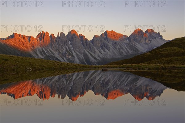 Kalkkoegel mountains reflected in lake