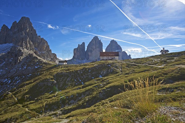 Dreizinnenhuette or Three Peaks Alpine hut and chapel in front of the north face of the Three Peaks