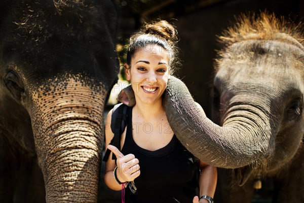 Elephant playing with tourist at an elephant camp