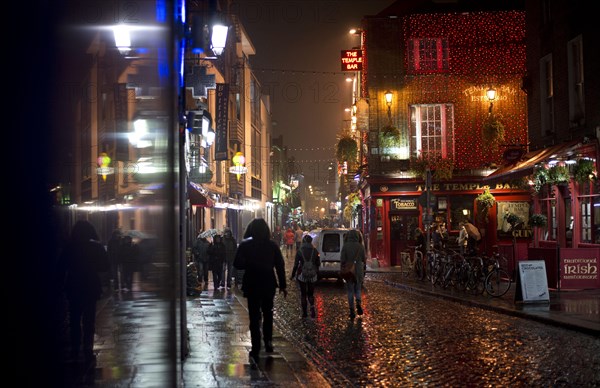 Passers-by in the street outside The Temple Bar