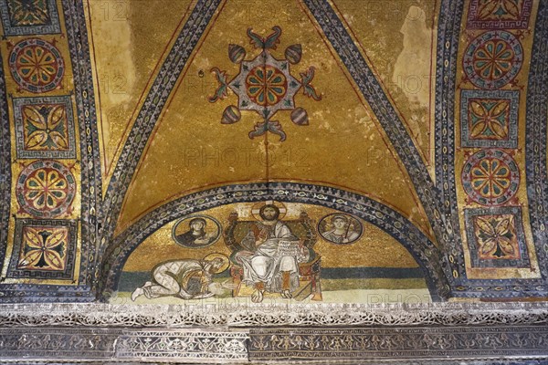 Byzantine mosaic of Jesus on a throne with the kneeling Emperor Leo VI in the narthex