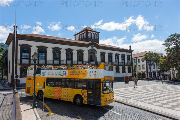 Tourist bus in front of the town hall or Camara Municipal of Funchal