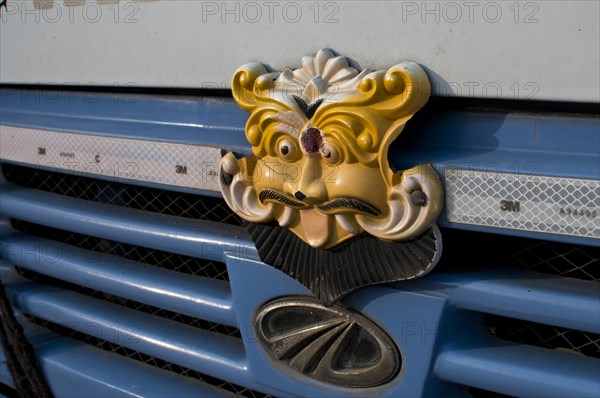 Representation of a deity on a truck bonnet