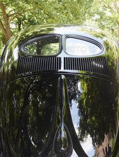 Rear view of a VW Beetle with a prezel window