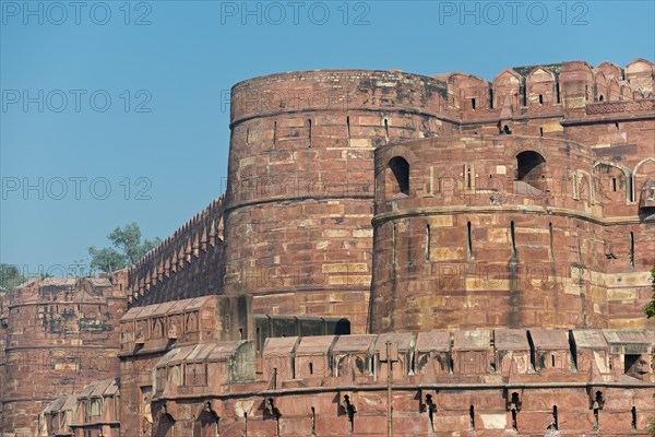 Fortified outer walls with battlements and loopholes