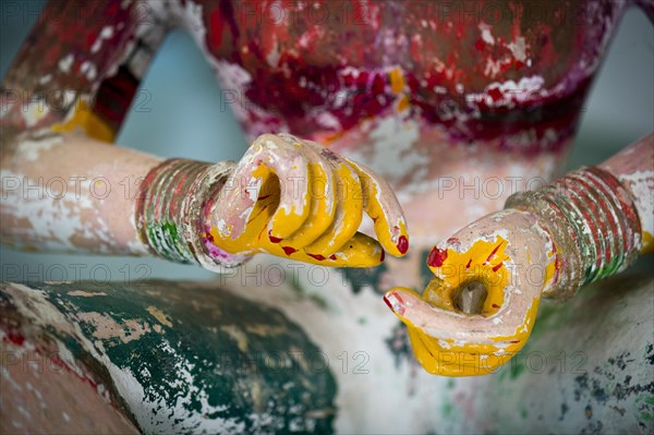 Hands of an old wooden temple figure