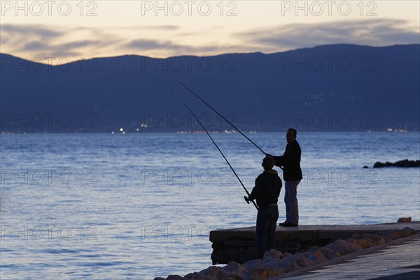 Anglers at dusk