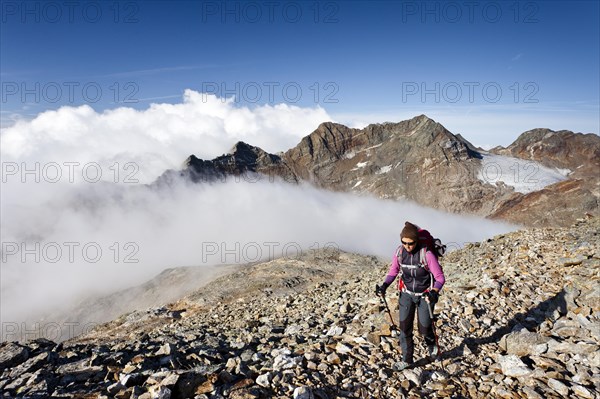 Climber trying to climb Fernerkoefl Mountain in the Rieserferner Group