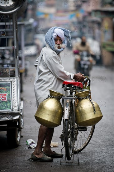 Milk seller with a turban and a bicycle