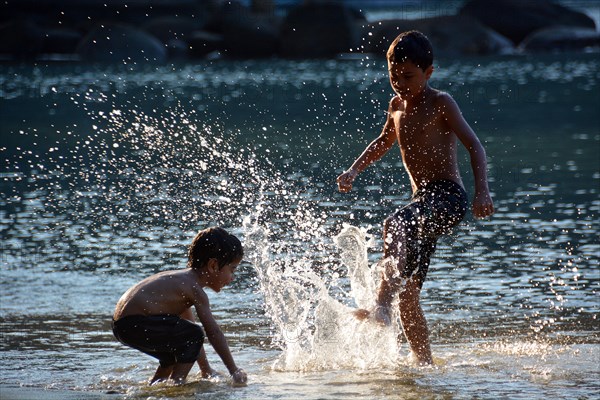 Children playing on the beach of Lopes Mendes