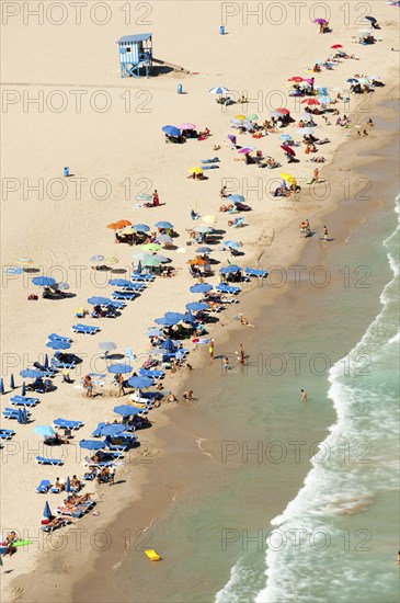 People sunbathing on the beach