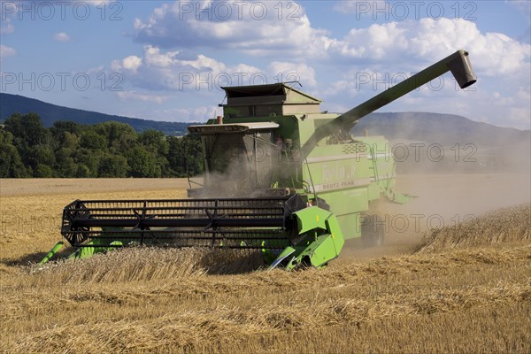 Combine harvester working in a wheat field