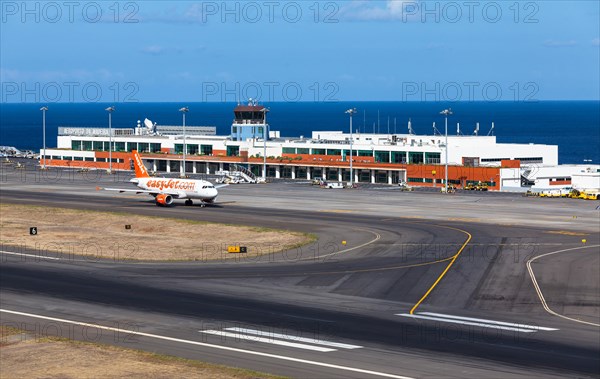 Airbus from easyjet.com in front of the terminal of Madeira Airport