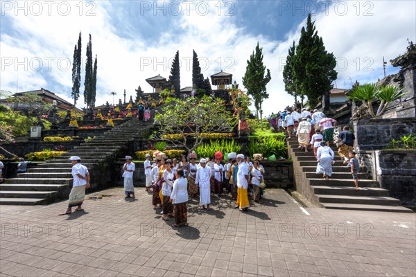 Worshippers gathering at the sacred temple of Pura Penetaran Agung Besakih