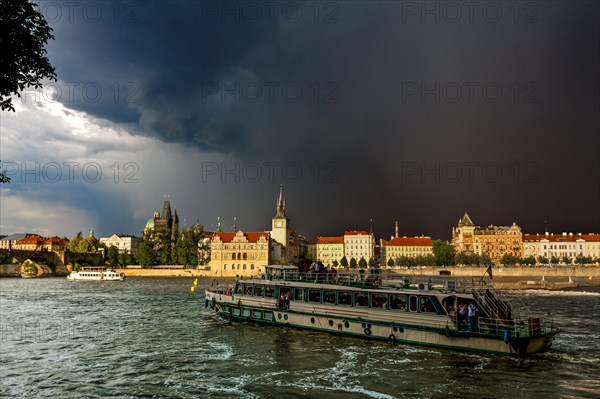 View over the Vltava river towards a thunderstorm