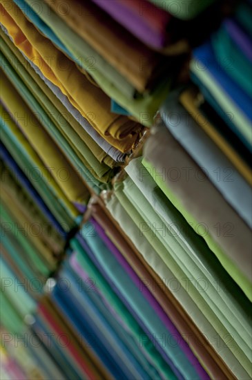 Fabrics lined up on a rack